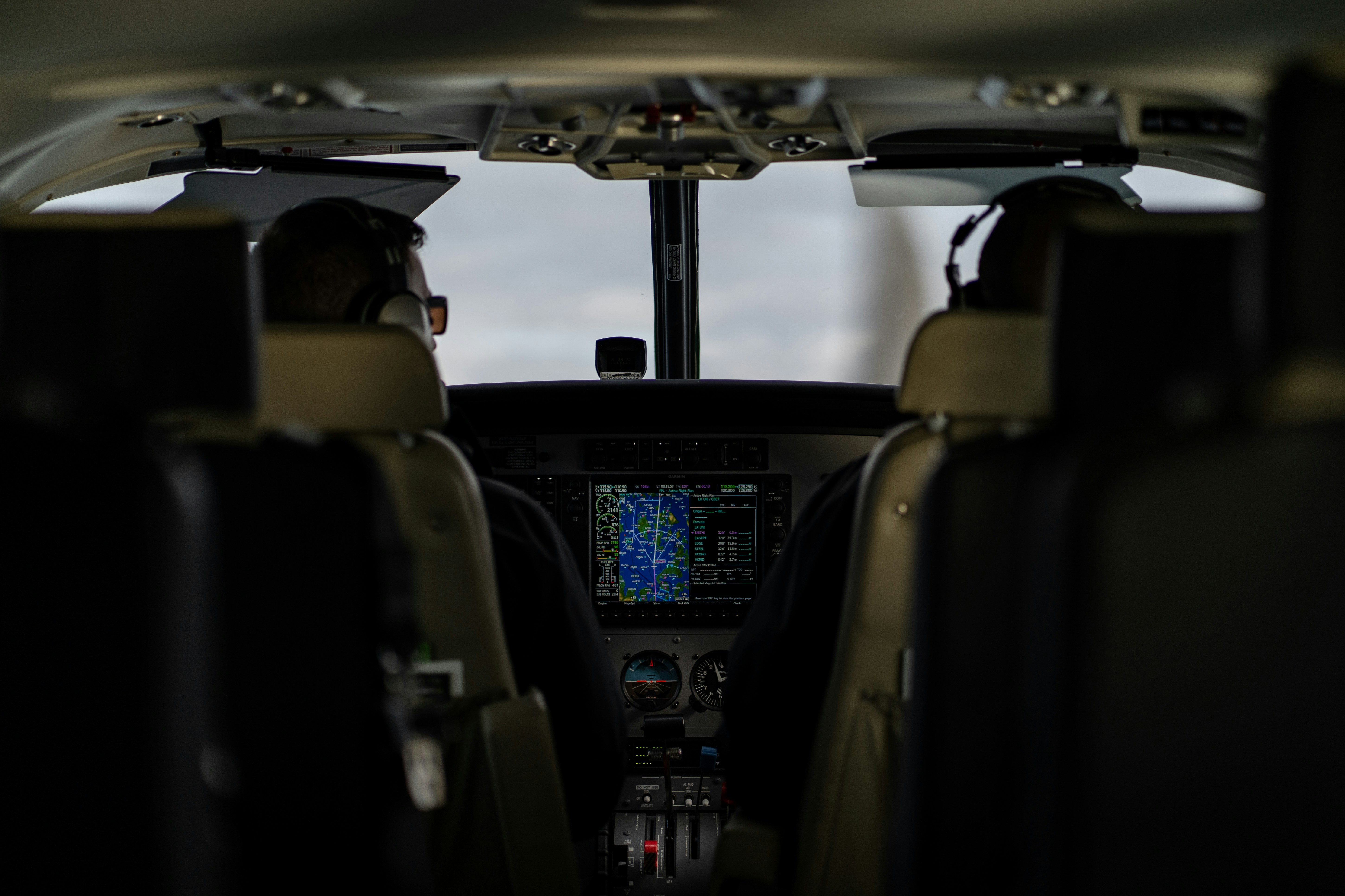 Pilots at work in the cockpit of an airliner